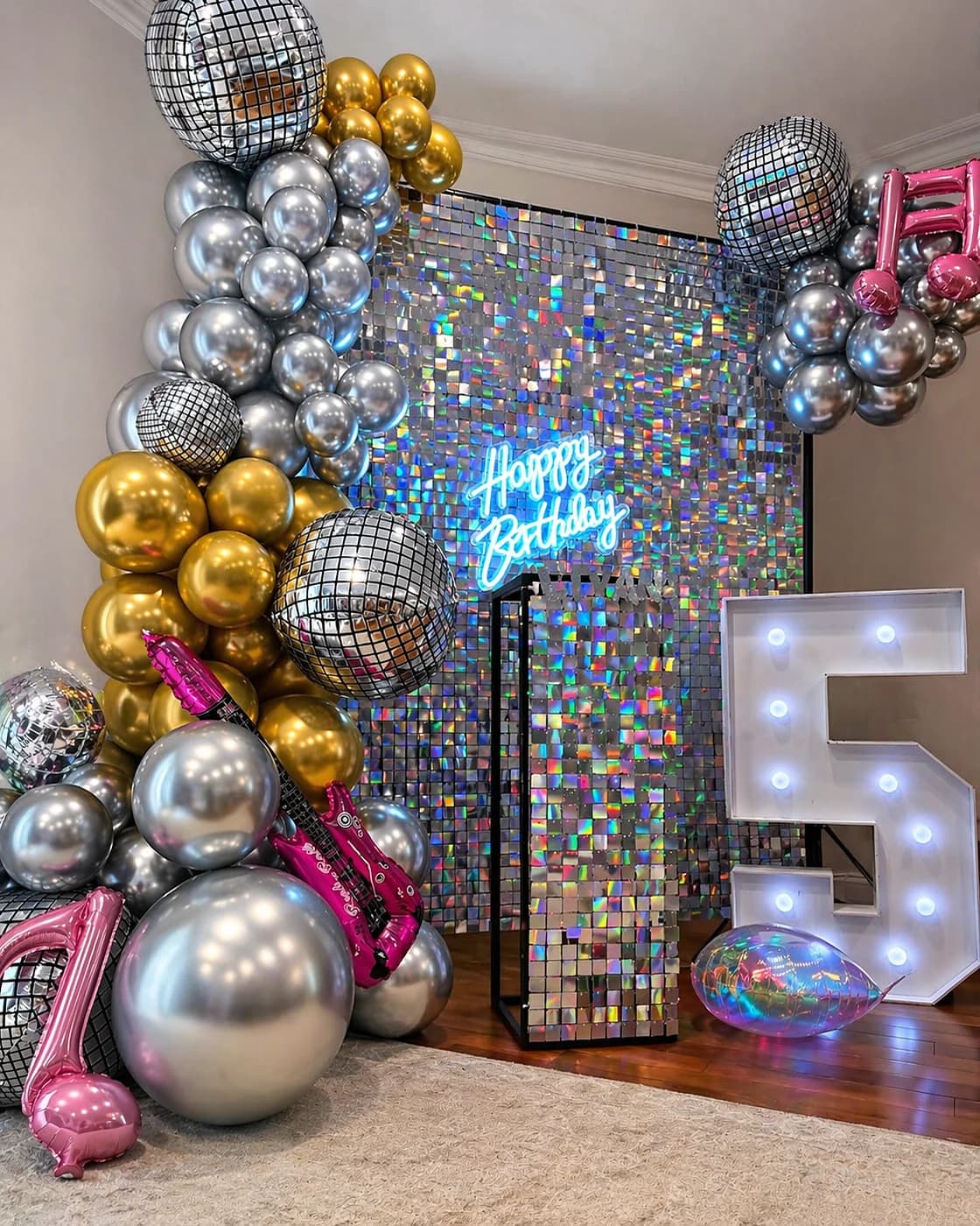 Disco-inspired fifth birthday balloon backdrop with shimmer wall and metallic styling