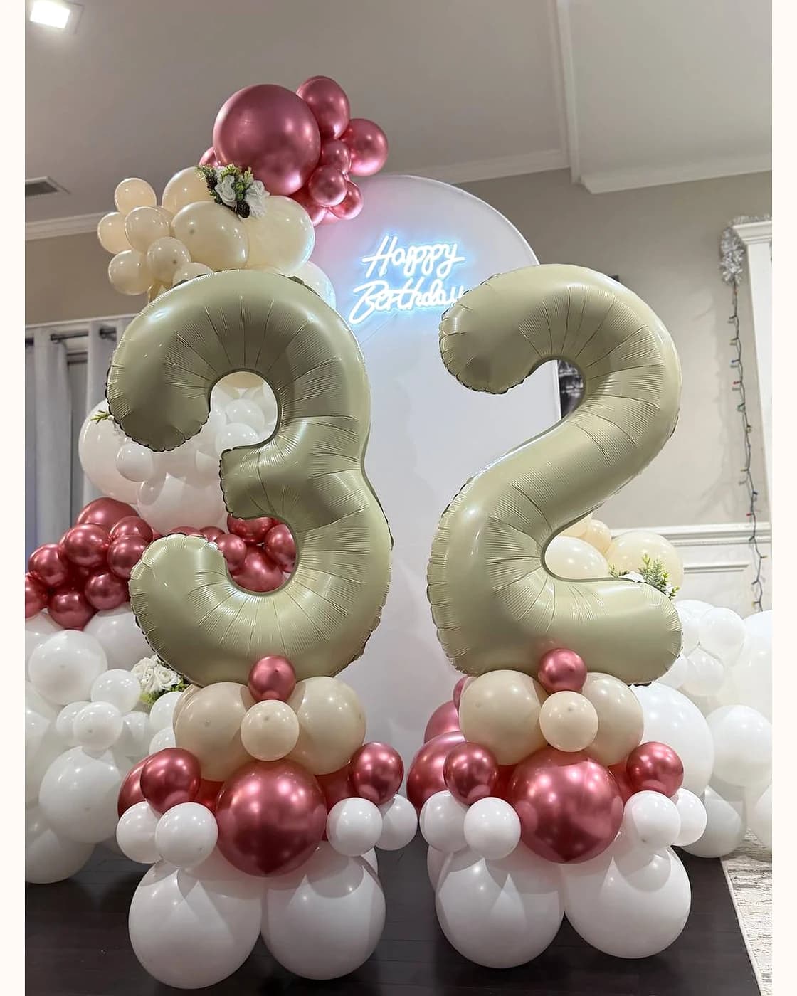 Elegant 32nd birthday balloon display with soft metallic tones and large number balloons