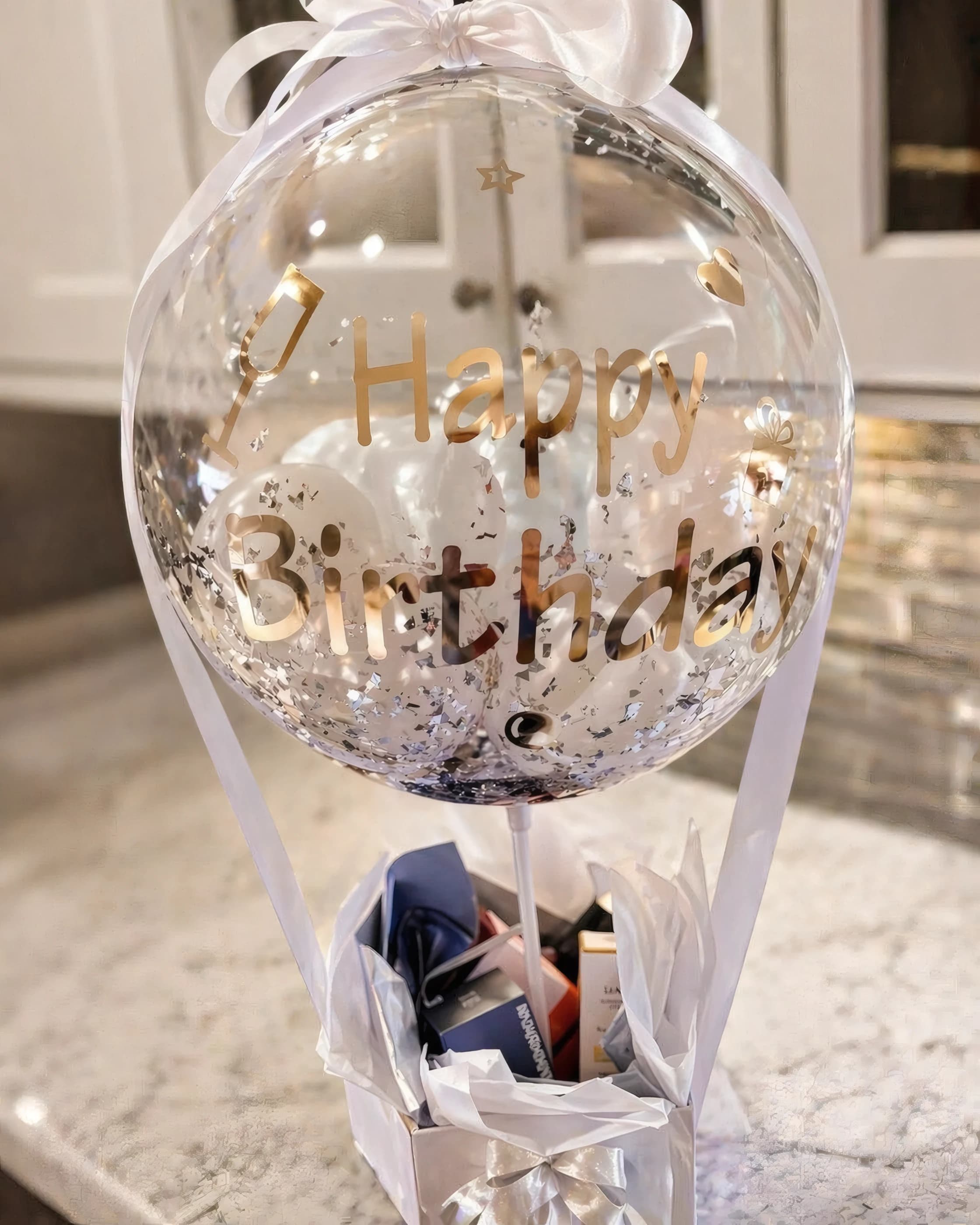 Personalized bubble balloon gift arrangement with bow and boxed base