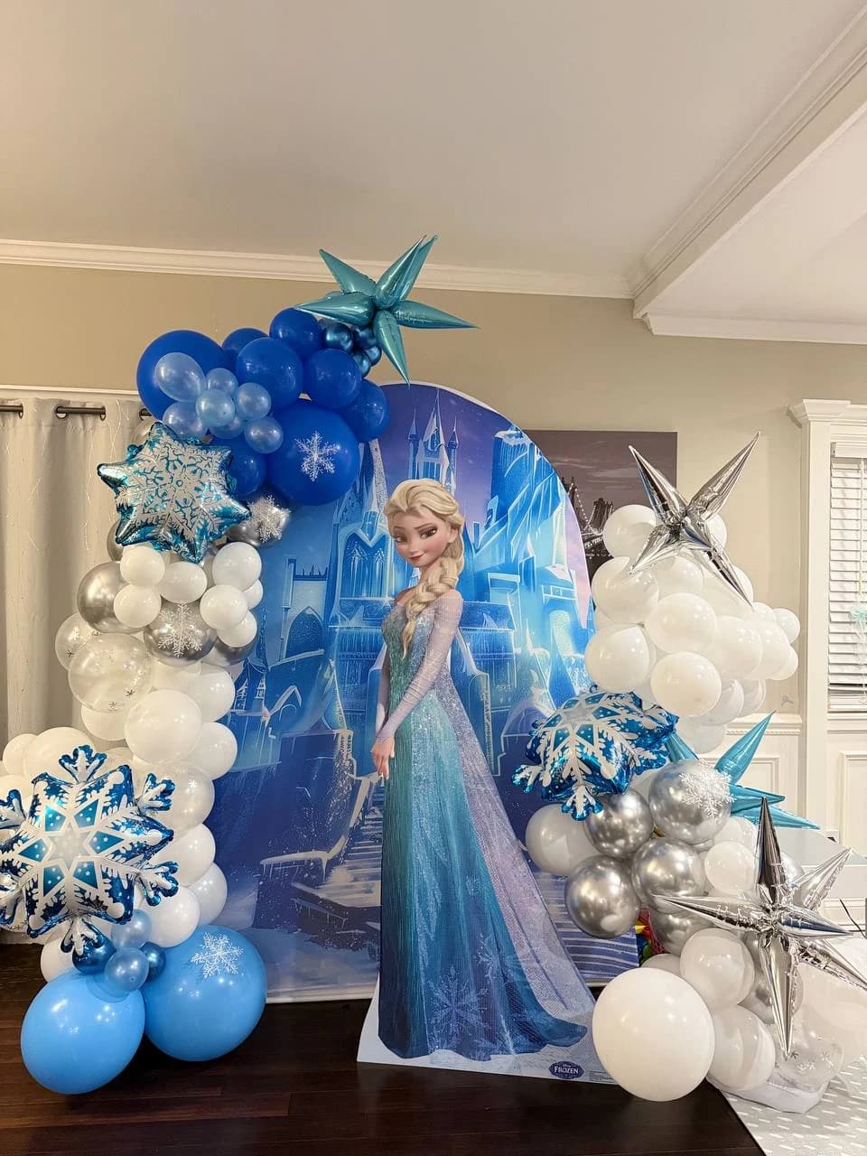 Blue, white, and silver Frozen-inspired balloon birthday backdrop