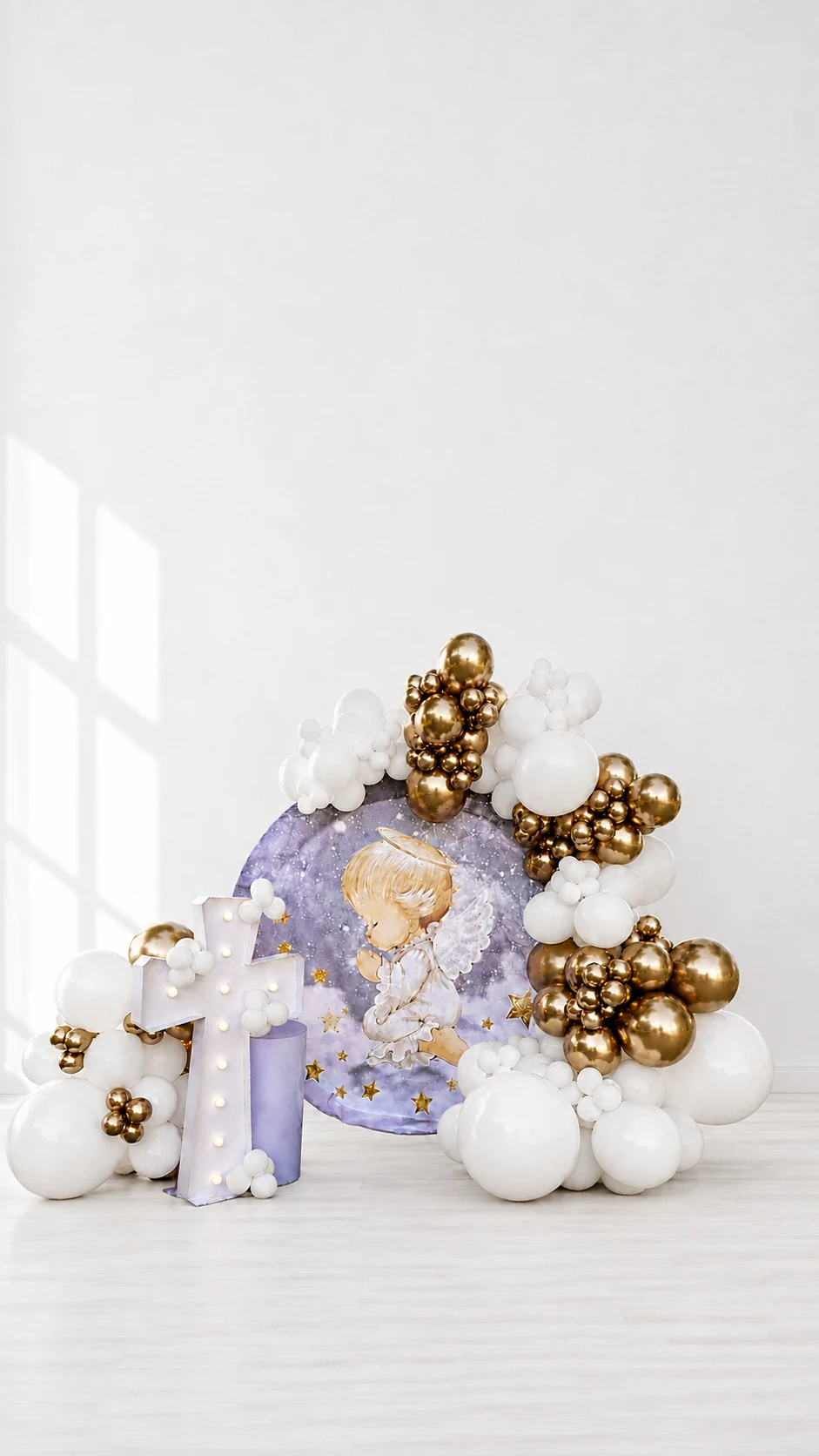 White and gold first-birthday balloon installation with a lavender celestial backdrop